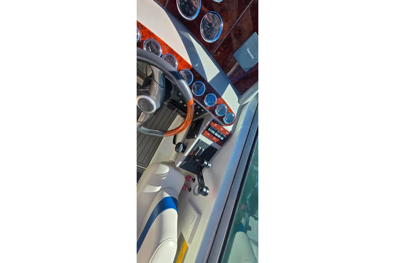 Slide: The Image of Cockpit view of 2002 Formula 370 Super Sport with gauges and steering wheel. - 9
