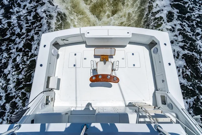 Slide: The Image of Aerial view of 1998 Bertram 60 Convertible yacht deck on water. - 12