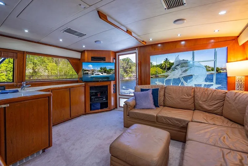 Slide: The Image of Luxurious interior of a 1998 Bertram 60 Convertible yacht with leather seating and scenic views. - 32
