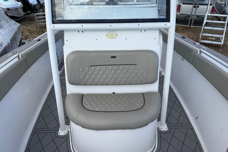 Slide: The Image of 2021 Sportsman Heritage 251 Center Console boat interior with cushioned seating. - 17