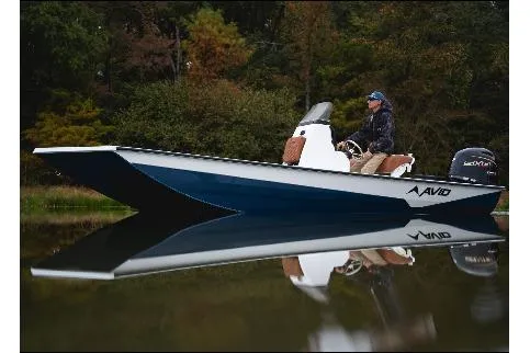 The Image of Avid 207 Recon 2026 boat on calm water, surrounded by lush greenery. - 1