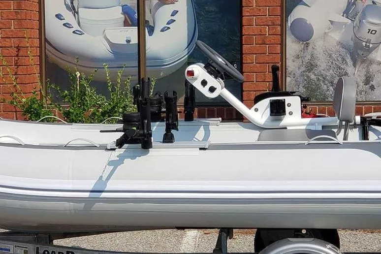 Slide: The Image of Gala A330hq 2026 inflatable boat with steering console on trailer. - 6