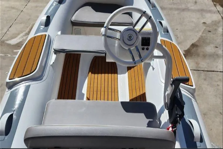 Slide: The Image of Interior view of Gala A330hq boat, 2026 model, featuring wood accents. - 9