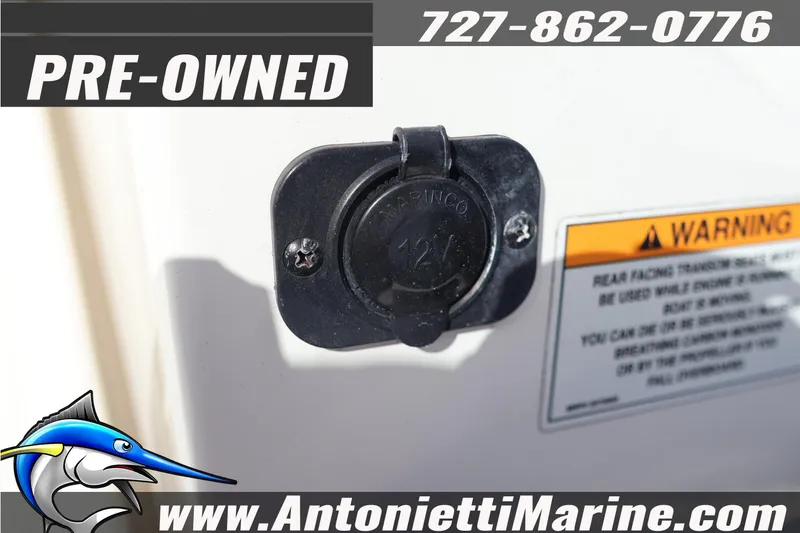 Slide: The Image of Pre-owned 2019 Sea Ray SPX 190 Outboard with 12V outlet and warning label. - 13