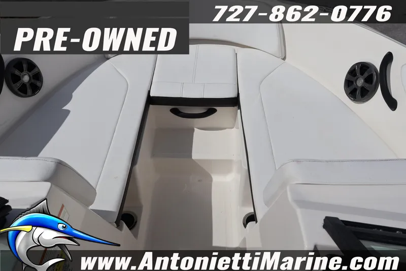 Slide: The Image of Pre-owned 2019 Sea Ray SPX 190 Outboard boat interior with seating and speakers. - 18