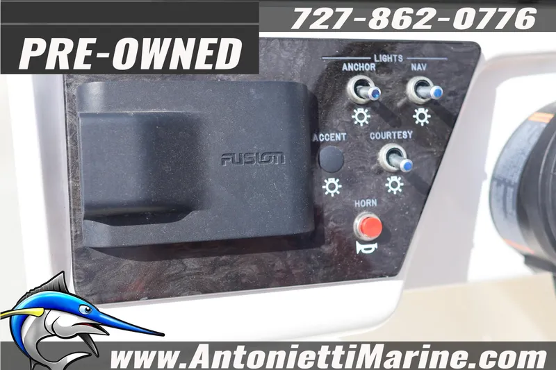 Slide: The Image of Pre-owned 2019 Sea Ray SPX 190 Outboard control panel with Fusion audio system. - 26