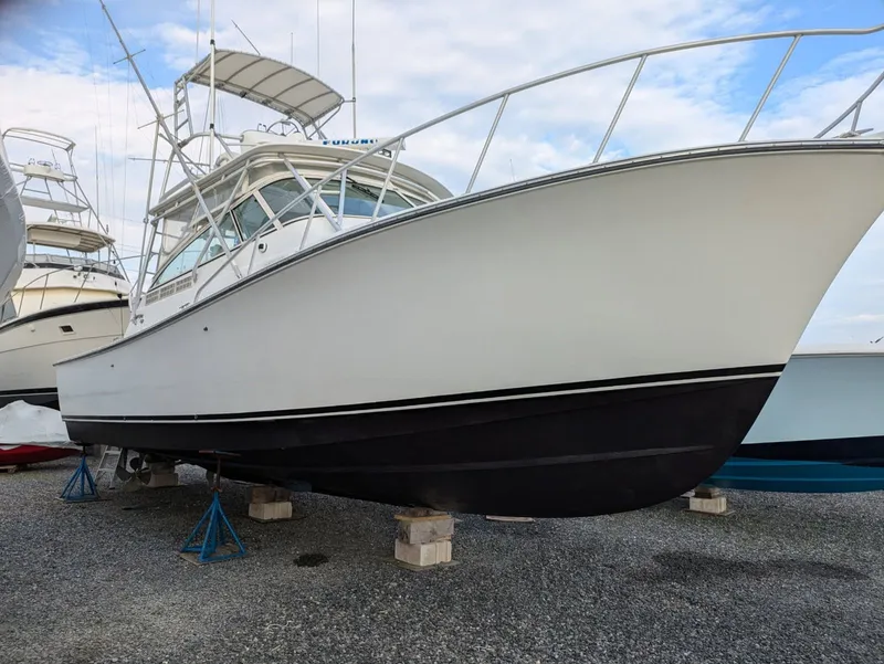 The Image of Henriques 35 Express 2000 boat on stands in gravel. - 0