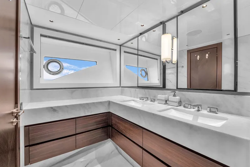Slide: The Image of Luxurious bathroom in 2024 Sunseeker Ocean 182 yacht with modern fixtures and ocean view. - 17