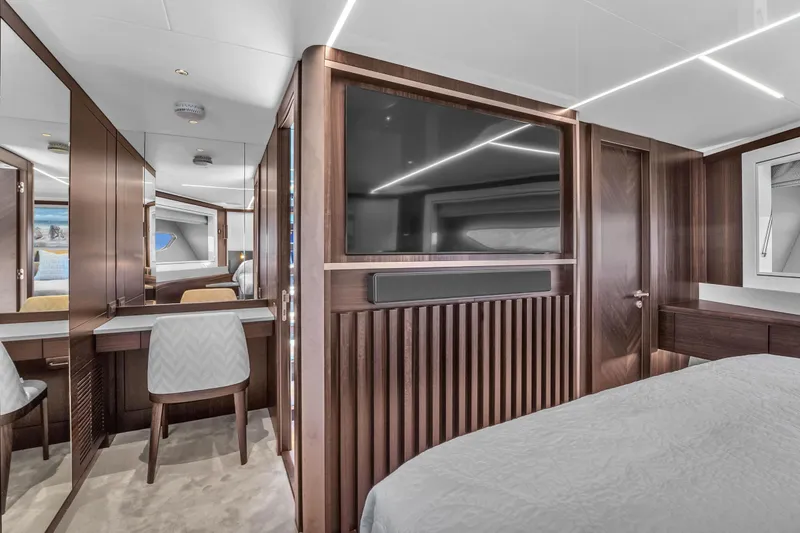 Slide: The Image of Luxurious interior of 2024 Sunseeker Ocean 182 yacht with modern wood finishes and elegant design. - 20