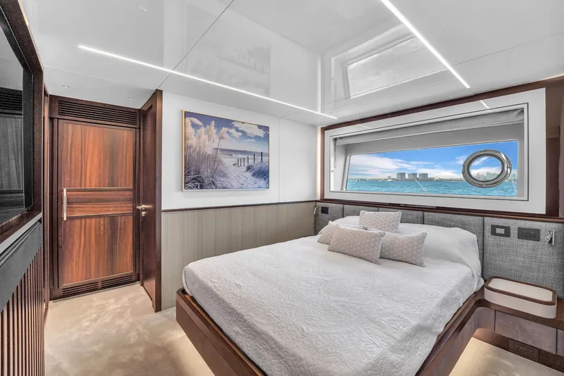 Slide: The Image of Luxurious bedroom interior of 2024 Sunseeker Ocean 182 yacht with ocean view window. - 21