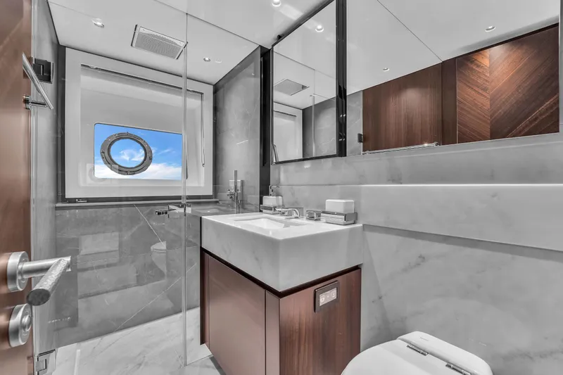 Slide: The Image of Luxurious bathroom in 2024 Sunseeker Ocean 182 yacht with modern fixtures and ocean view. - 24