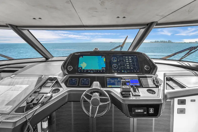 Slide: The Image of Cockpit of 2024 Sunseeker Ocean 182 yacht with advanced navigation systems and ocean view. - 26