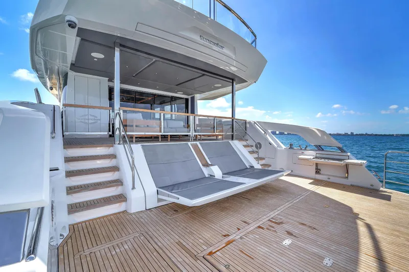 Slide: The Image of 2024 Sunseeker Ocean 182 yacht deck with luxurious seating and ocean view. - 3