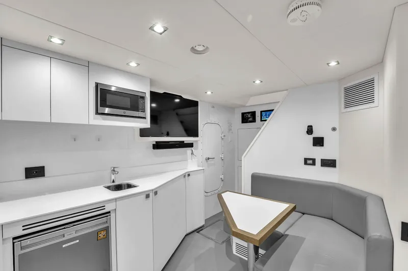 Slide: The Image of Modern interior of 2024 Sunseeker Ocean 182 yacht with sleek kitchen and seating area. - 31