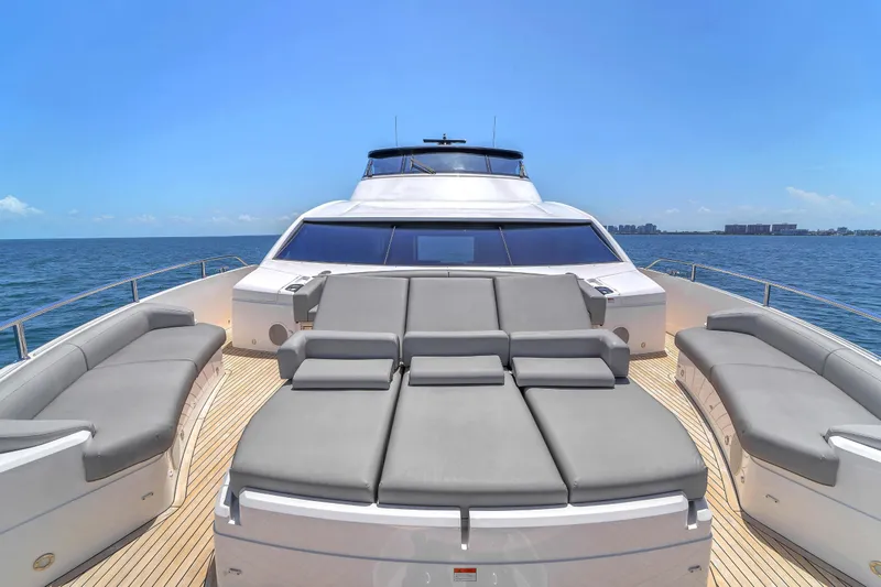 Slide: The Image of 2024 Sunseeker Ocean 182 yacht with luxurious sunbathing deck on open sea. - 6