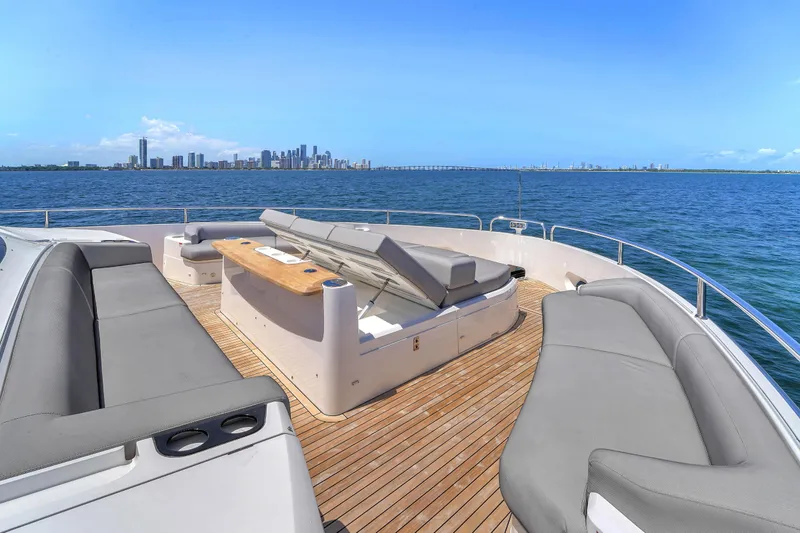 Slide: The Image of Luxurious 2024 Sunseeker Ocean 182 yacht deck with city skyline view. - 7