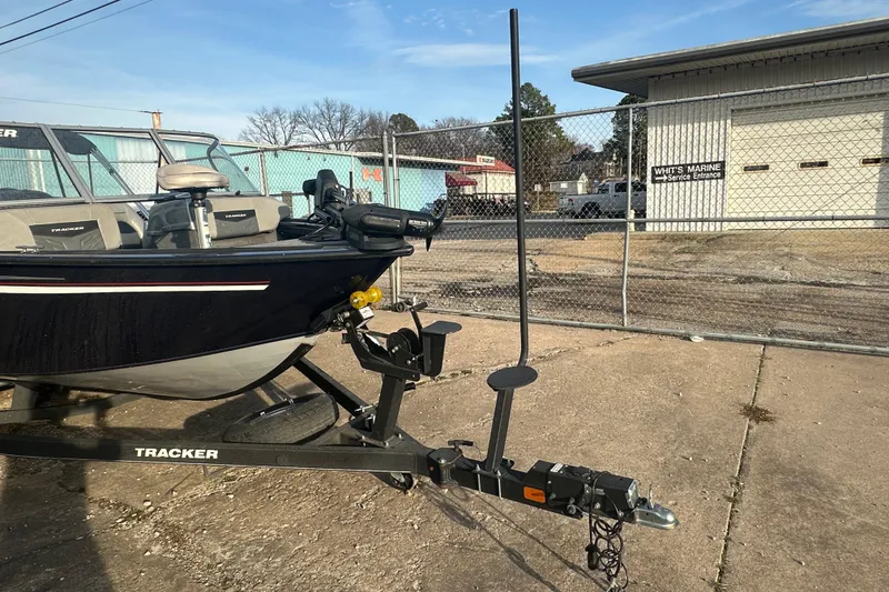 Slide: The Image of 2019 Tracker Targa V-18 Combo boat on trailer at marine service entrance. - 13