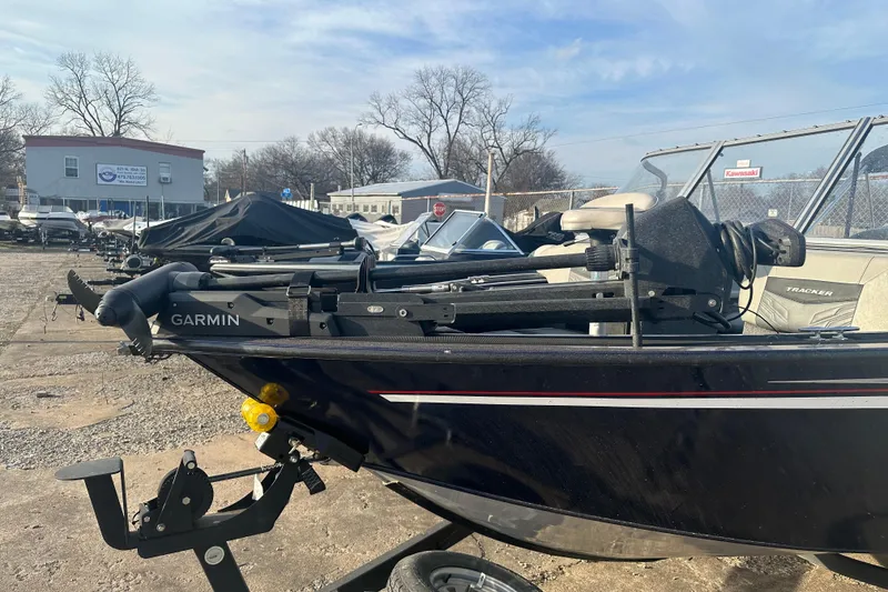Slide: The Image of 2019 Tracker Targa V-18 Combo boat with Garmin equipment, parked outdoors. - 2