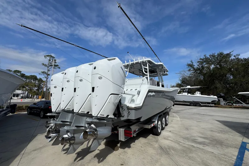Slide: The Image of 2026 Invincible 43 Open Fisherman boat with multiple engines on a trailer. - 16