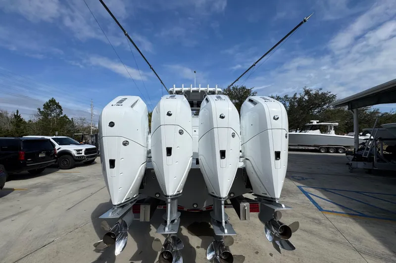 Slide: The Image of 2026 Invincible 43 Open Fisherman with four powerful outboard engines, parked outdoors. - 18