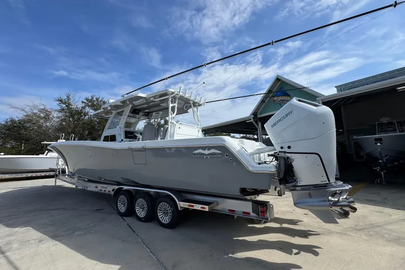 Slide: The Image of 2026 Invincible 43 Open Fisherman boat with Mercury engines on a trailer. - 21