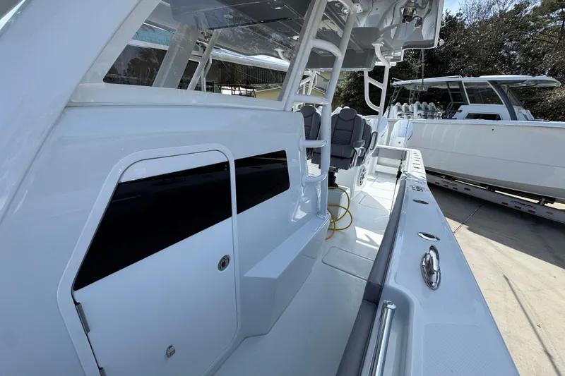 Slide: The Image of 2026 Invincible 43 Open Fisherman boat interior with seating and storage compartments. - 30