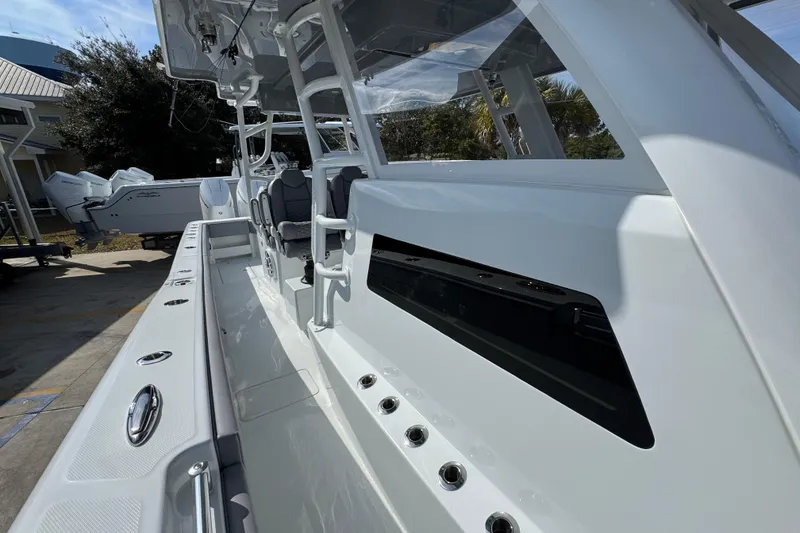 Slide: The Image of 2026 Invincible 43 Open Fisherman boat, sleek design, spacious deck, modern features. - 31