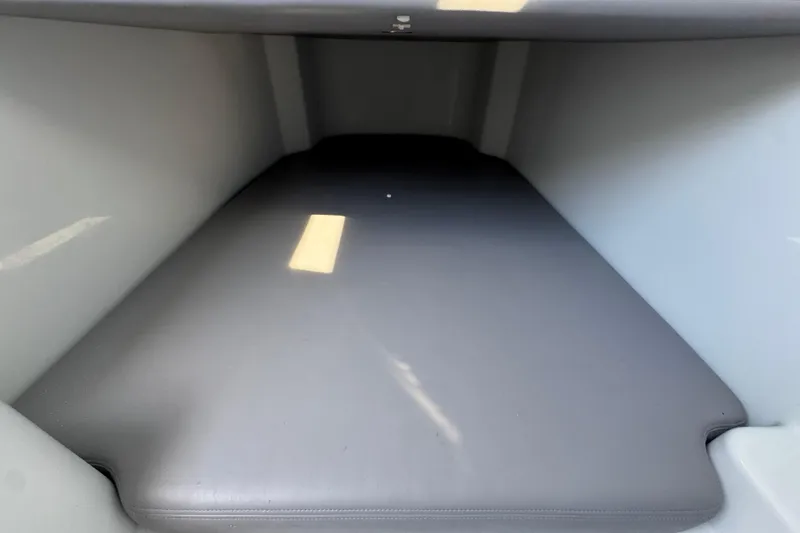 Slide: The Image of Interior cabin of 2026 Invincible 43 Open Fisherman boat, featuring a cushioned surface. - 36
