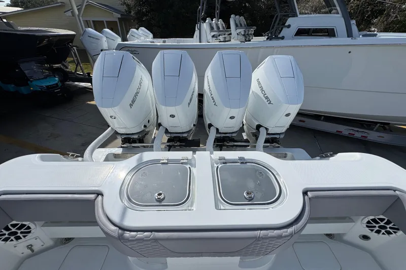 Slide: The Image of 2026 Invincible 43 Open Fisherman with four Mercury outboard engines. - 53