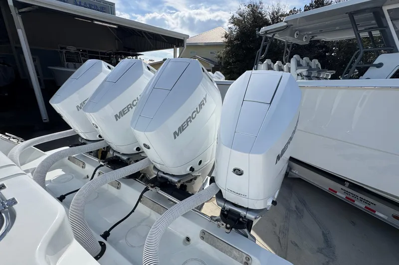 Slide: The Image of Four Mercury outboard engines on a 2026 Invincible 43 Open Fisherman boat. - 55