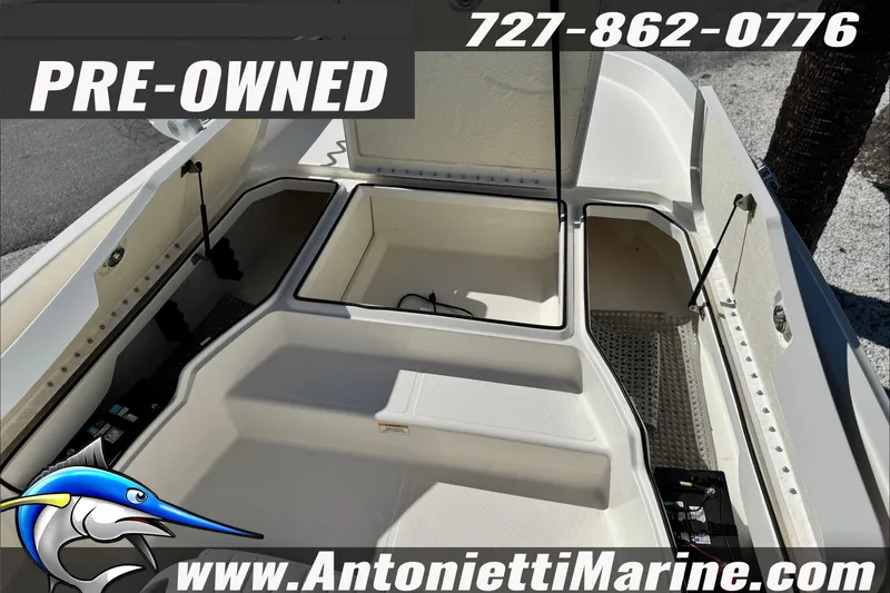 Slide: The Image of Pre-owned 2021 Bayliner Trophy T21Bay boat interior with storage compartments. - 11