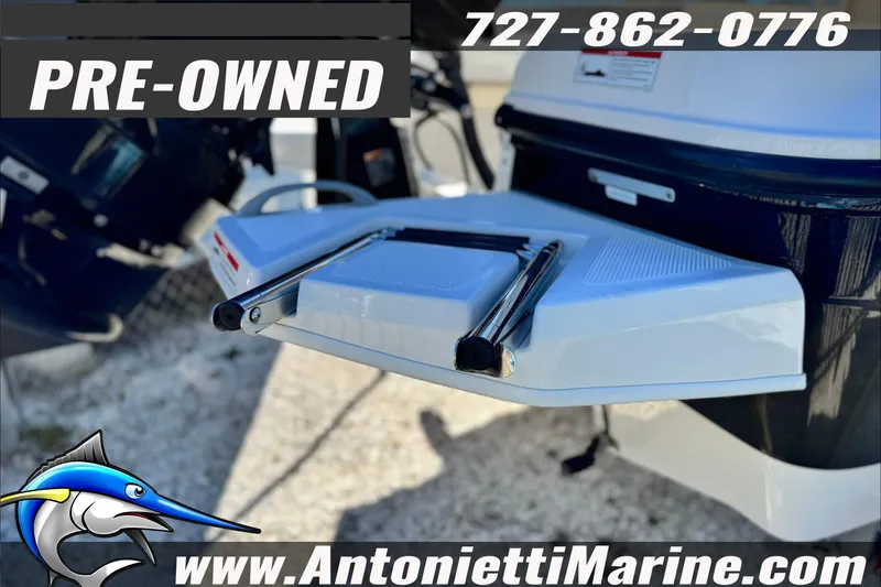 Slide: The Image of Pre-owned 2021 Bayliner Trophy T21Bay boat with swim platform, Antonietti Marine contact details. - 5