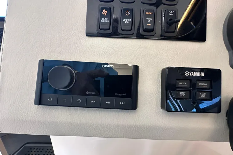 Slide: The Image of Control panel of a 2021 Regal 36 XO boat with Fusion and Yamaha systems. - 12