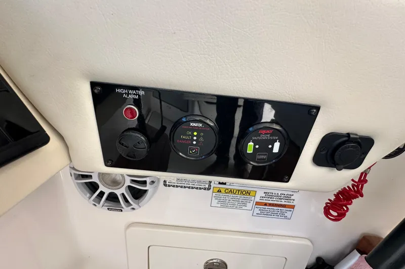 Slide: The Image of Control panel of a 2021 Regal 36 XO boat with high water alarm and engine shutdown system. - 17