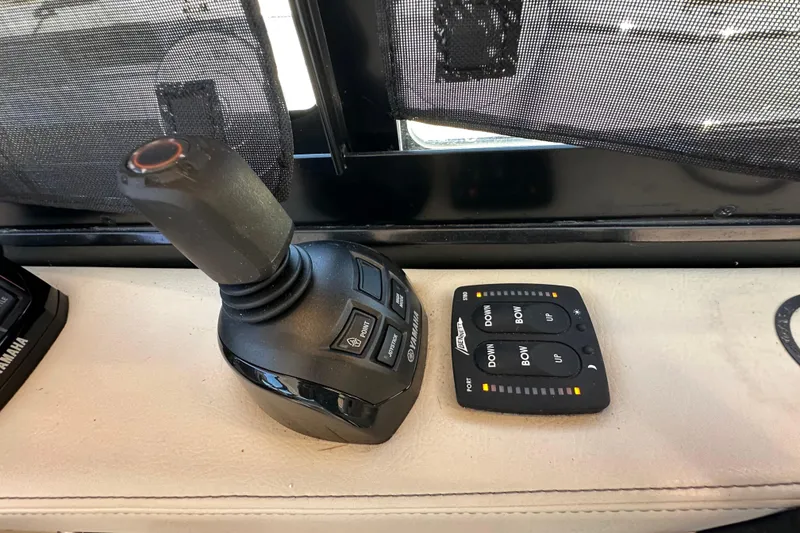 Slide: The Image of 2021 Regal 36 XO boat joystick and control panel on dashboard. - 18
