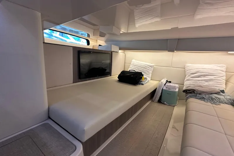 Slide: The Image of Luxurious interior of 2021 Regal 36 XO yacht with cozy seating and modern amenities. - 30