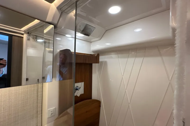 Slide: The Image of Interior of 2021 Regal 36 XO yacht bathroom with modern fixtures and lighting. - 34