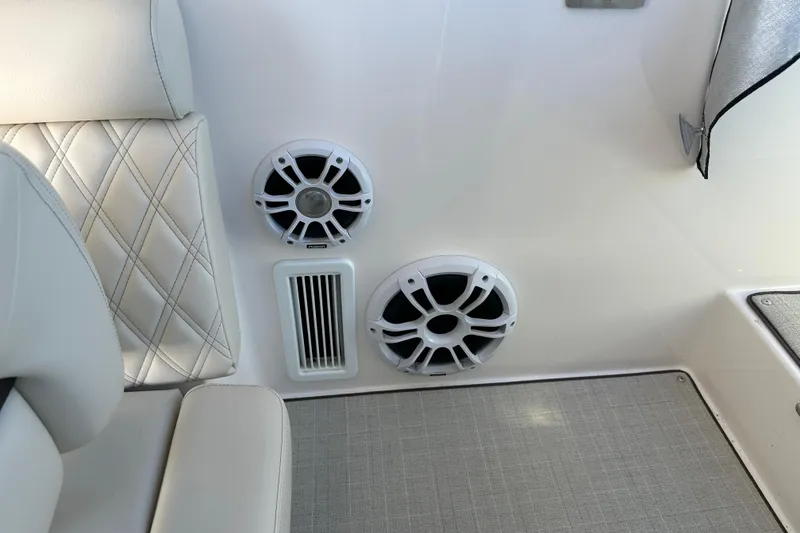 Slide: The Image of Luxury seating and speakers on 2021 Regal 36 XO boat interior. - 40