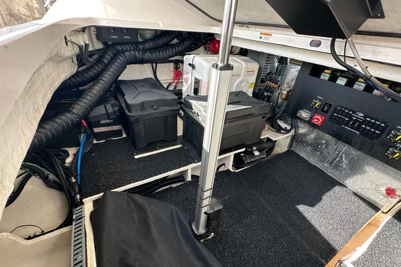 Slide: The Image of 2021 Regal 36 XO engine compartment with batteries and control panel. - 47