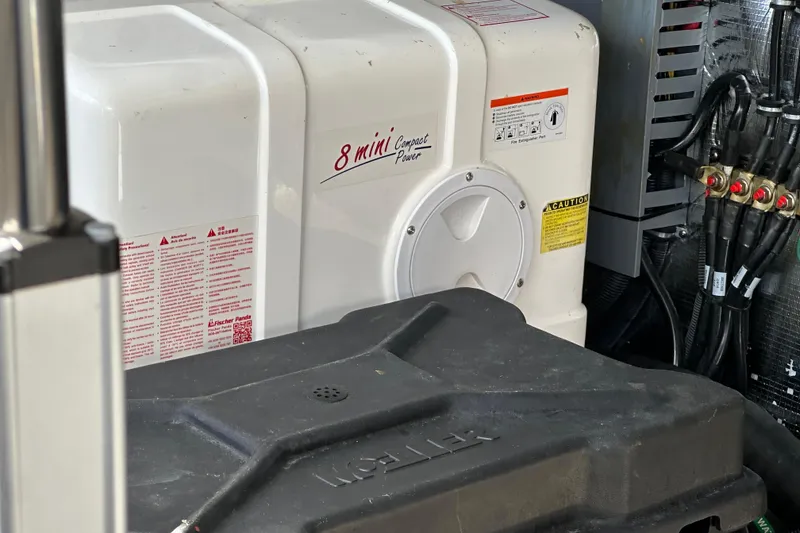 Slide: The Image of Engine compartment of a 2021 Regal 36 XO boat with Fischer Panda generator. - 48