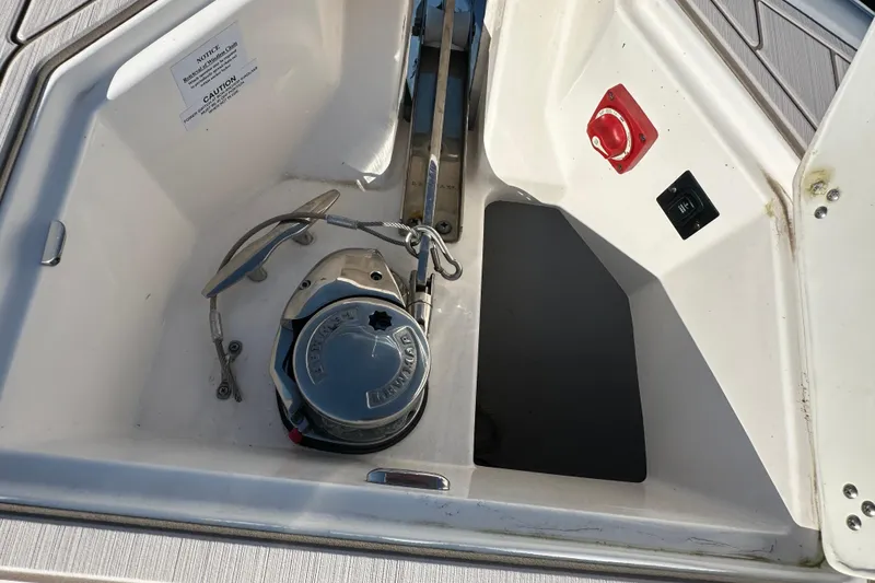 Slide: The Image of Anchor compartment of 2021 Regal 36 XO boat with winch and controls. - 52