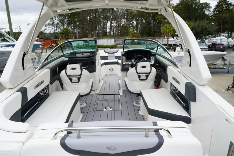Slide: The Image of 2024 Chaparral 287 SSX boat interior with luxurious seating and modern dashboard design. - 3