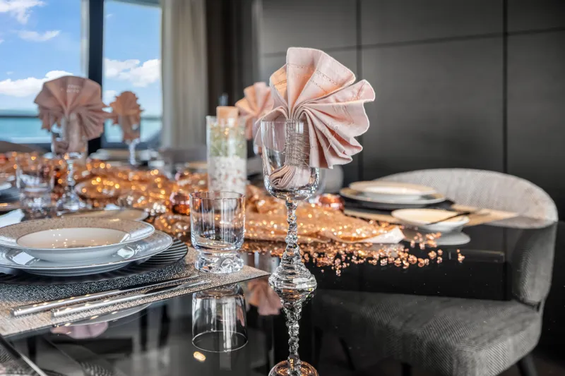 Slide: The Image of Luxurious interior of 2023 Custom Line NAVETTA 42 yacht with elegant dining setup. - 22