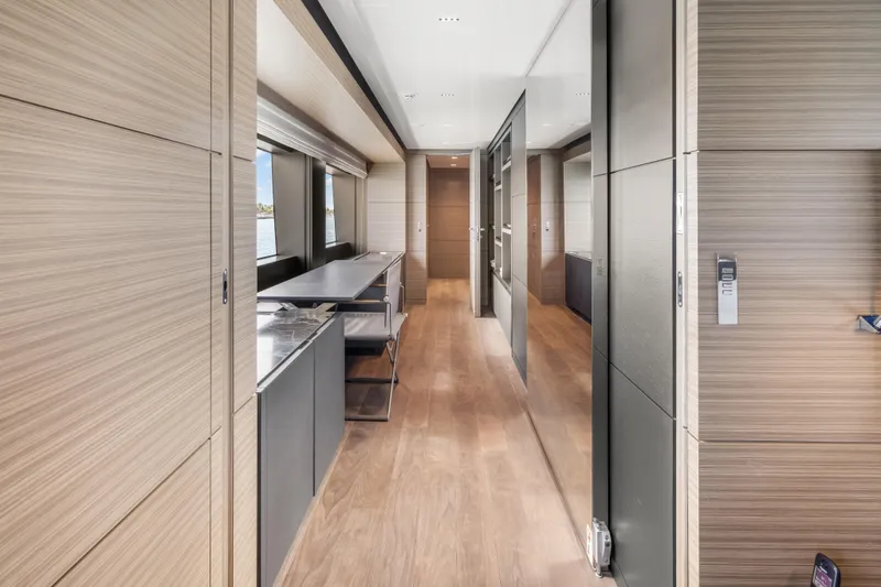 Slide: The Image of Luxurious interior of 2023 Custom Line NAVETTA 42 yacht with modern furnishings and large windows. - 24