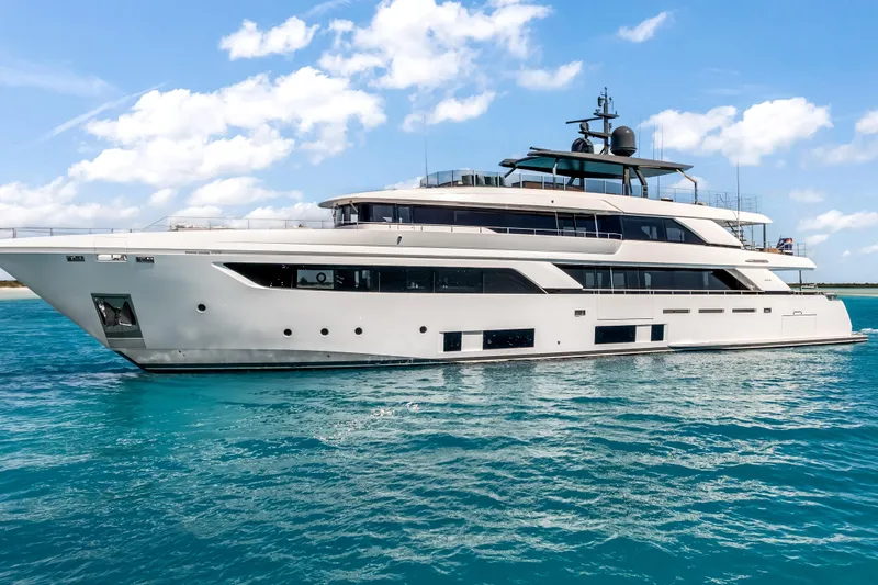 Slide: The Image of Luxurious 2023 Custom Line NAVETTA 42 yacht cruising on clear blue ocean. - 3