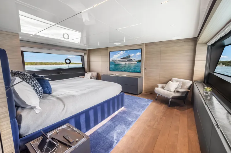 Slide: The Image of Luxurious 2023 Custom Line NAVETTA 42 yacht bedroom with modern decor and scenic ocean views. - 30