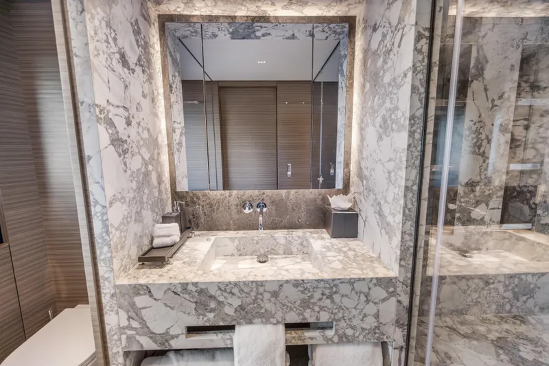 Slide: The Image of Luxurious marble bathroom in 2023 Custom Line NAVETTA 42 yacht, featuring modern fixtures and elegant design. - 31