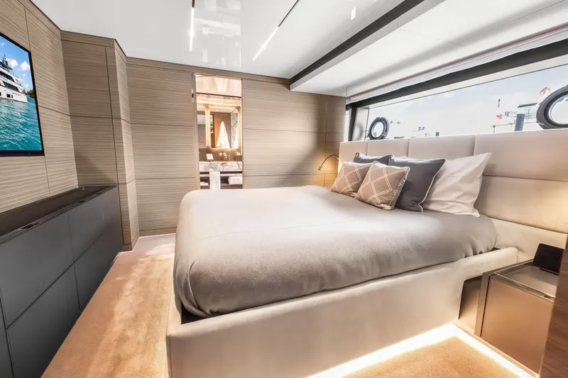 Slide: The Image of Luxurious 2023 Custom Line NAVETTA 42 yacht interior with modern wood paneling and marble flooring. - 33