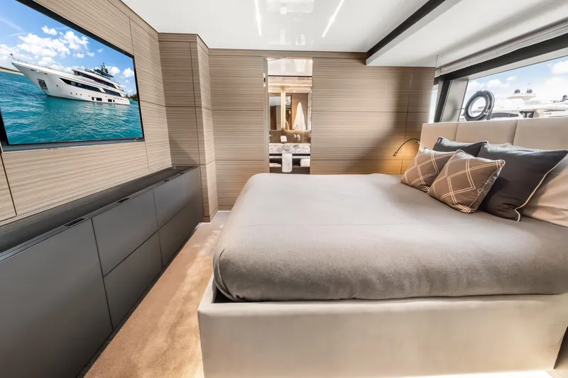 Slide: The Image of Luxurious bedroom interior of 2023 Custom Line NAVETTA 42 yacht, featuring elegant design and modern amenities. - 34