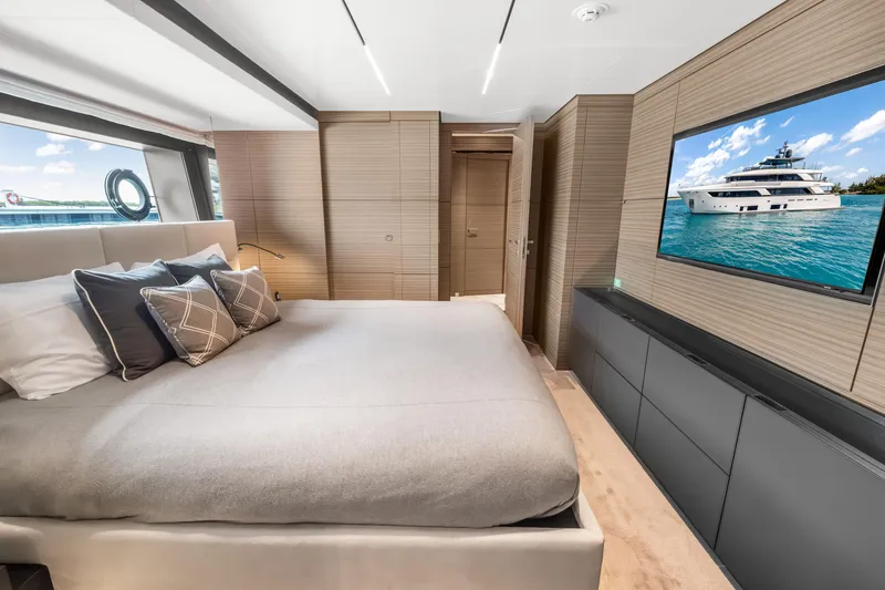 Slide: The Image of Luxurious bedroom interior of 2023 Custom Line NAVETTA 42 yacht with modern design elements. - 35